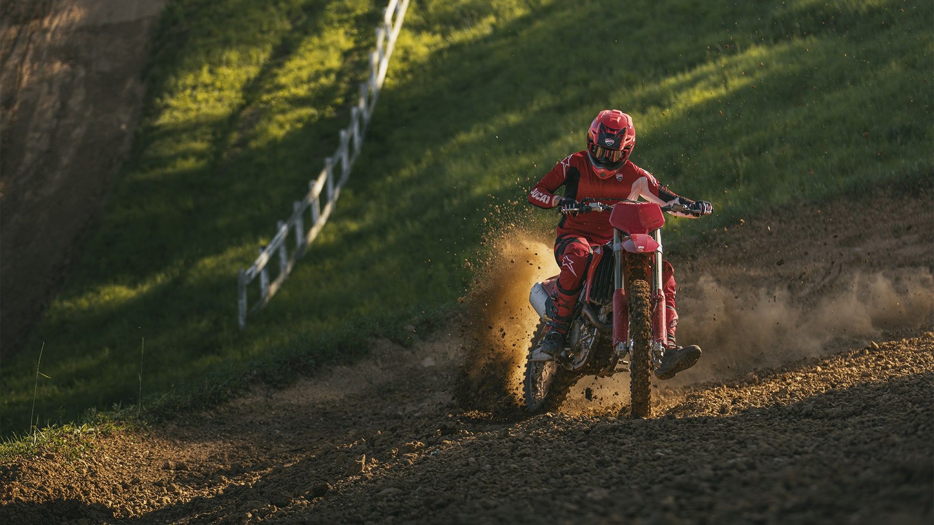 A Desmo250 MX on a motocross track, photographed by Ducati