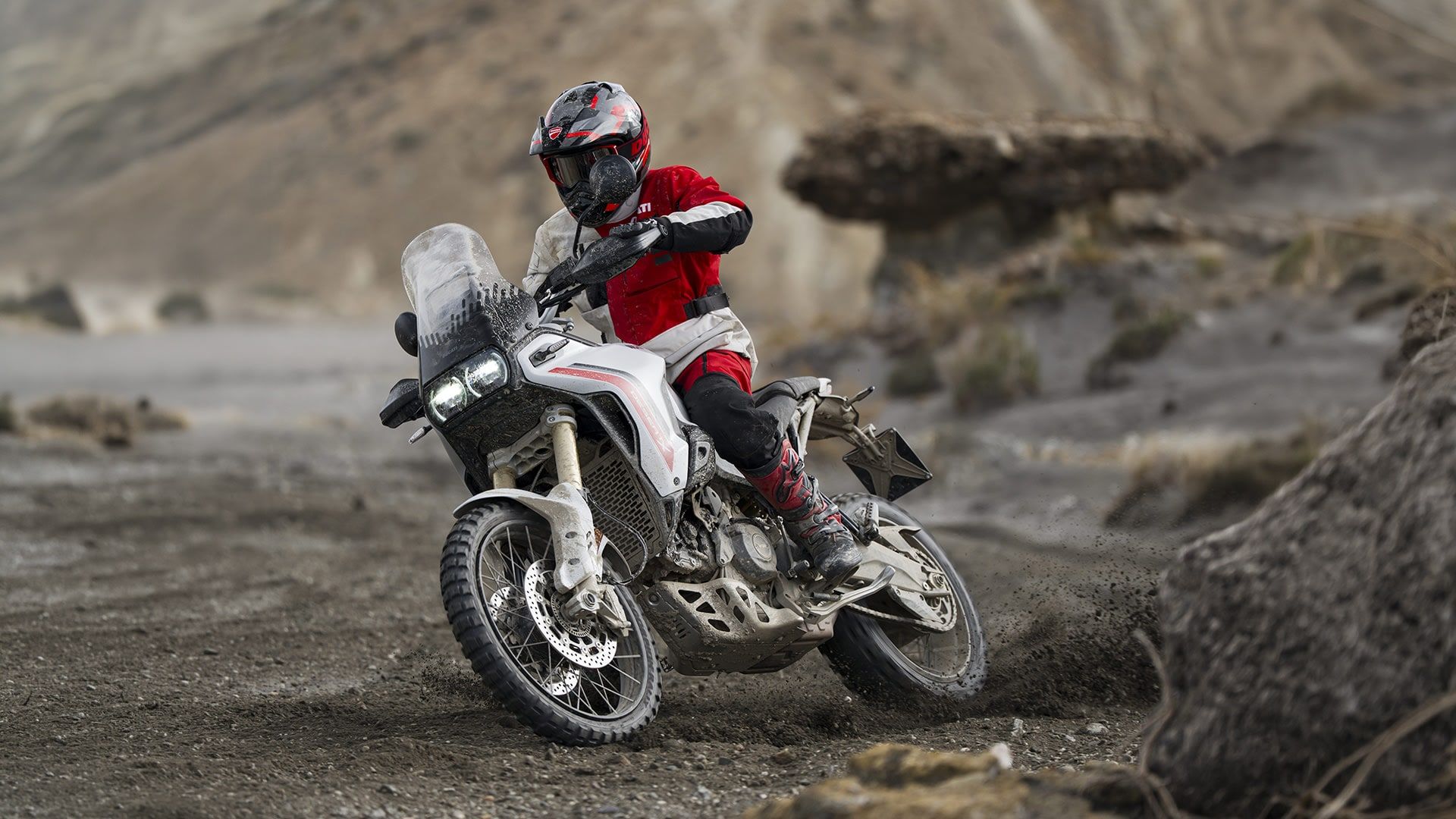 A DesertX ridden off-road in the desert, photographed by Ducati